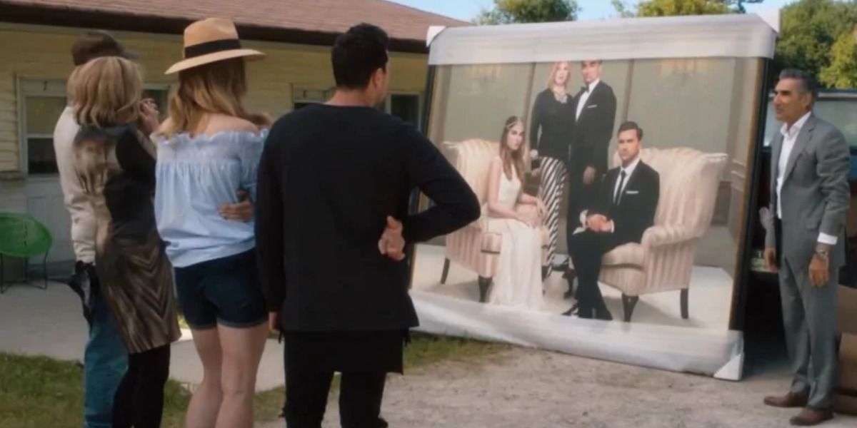 On Schitt's Creek, The Rose family looking at a portrait of themselves that hung in their house before they lost it all