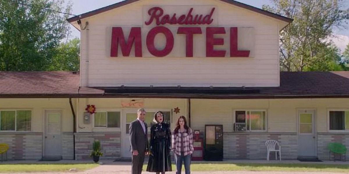 On Schitt's Creek, David, Moira &amp; Stevie in front of the spruced up motel bearing it's new name Rosebud