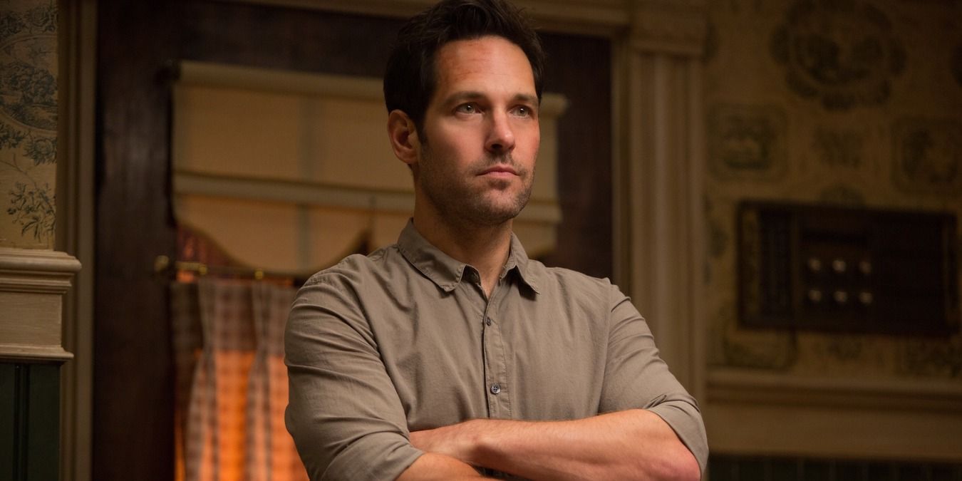Scott Lang standing with his arms crossed, wearing everyday clothes in Ant-Man