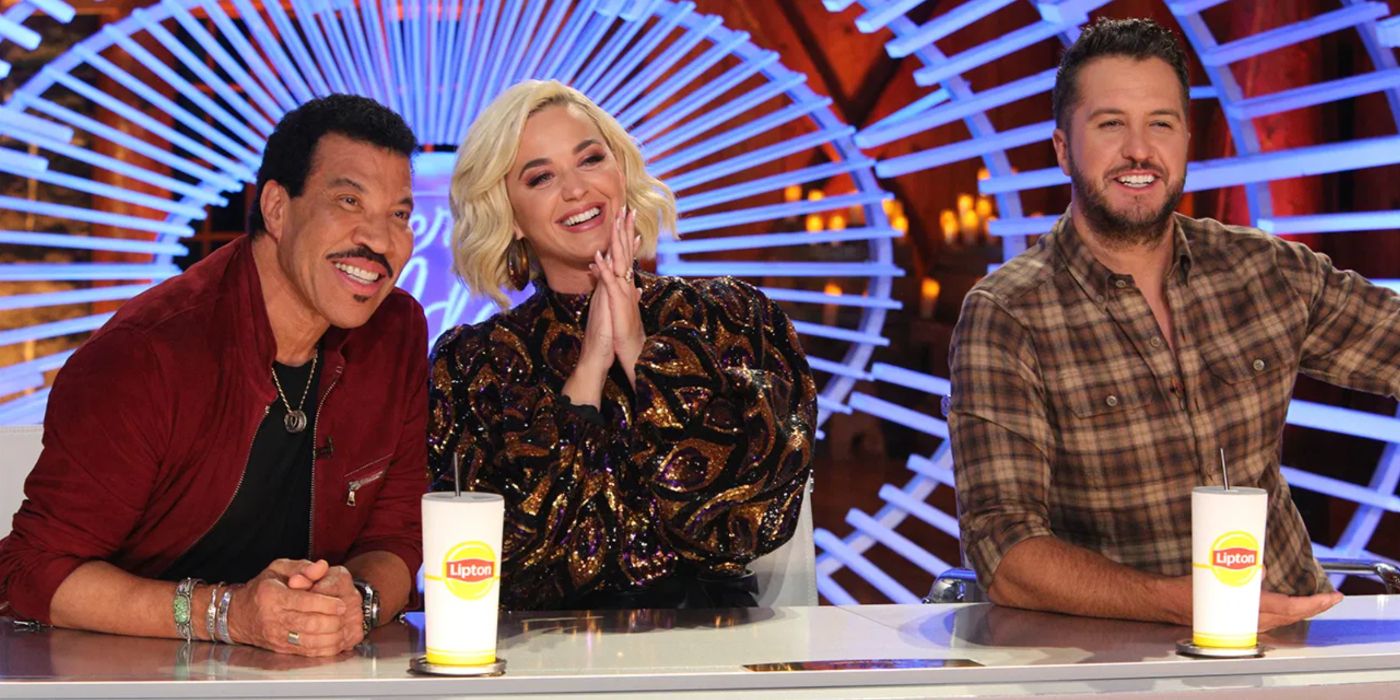 Katy Perry, Lionel Richie, and Luke Bryan admire a singer at the judges table