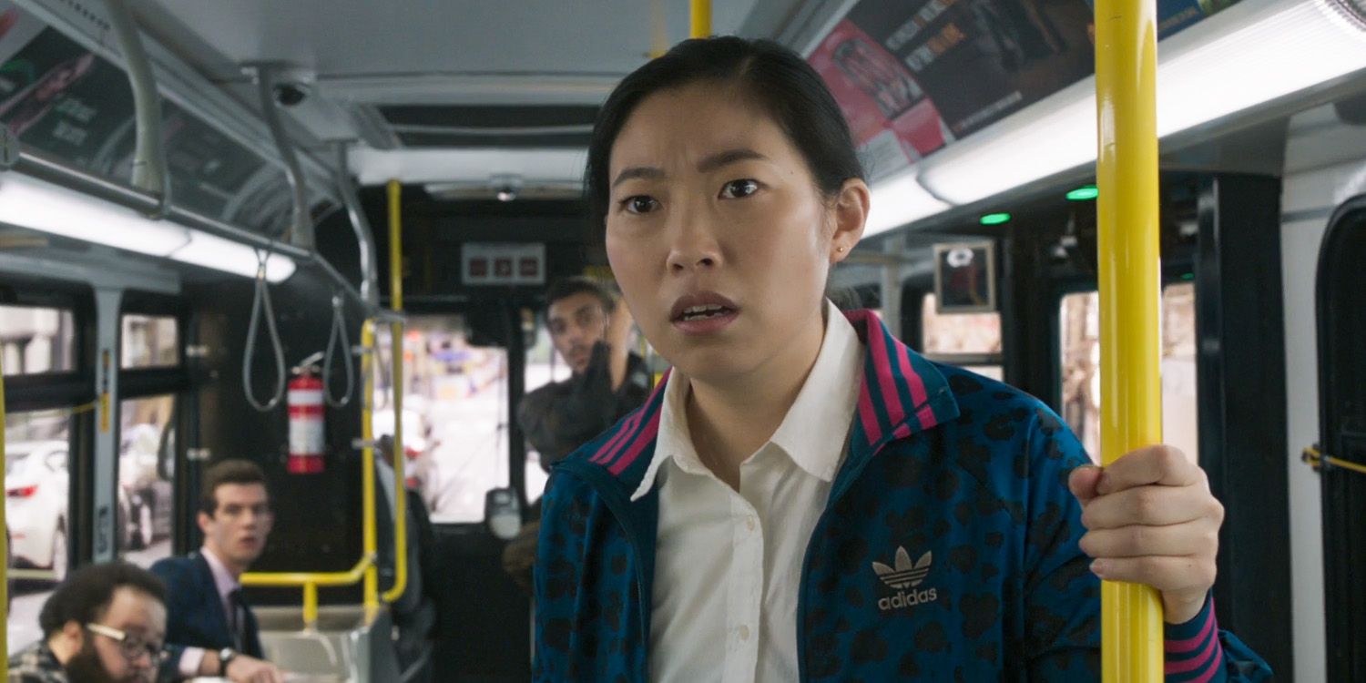 Katy on bus looking shocked in Shang-Chi