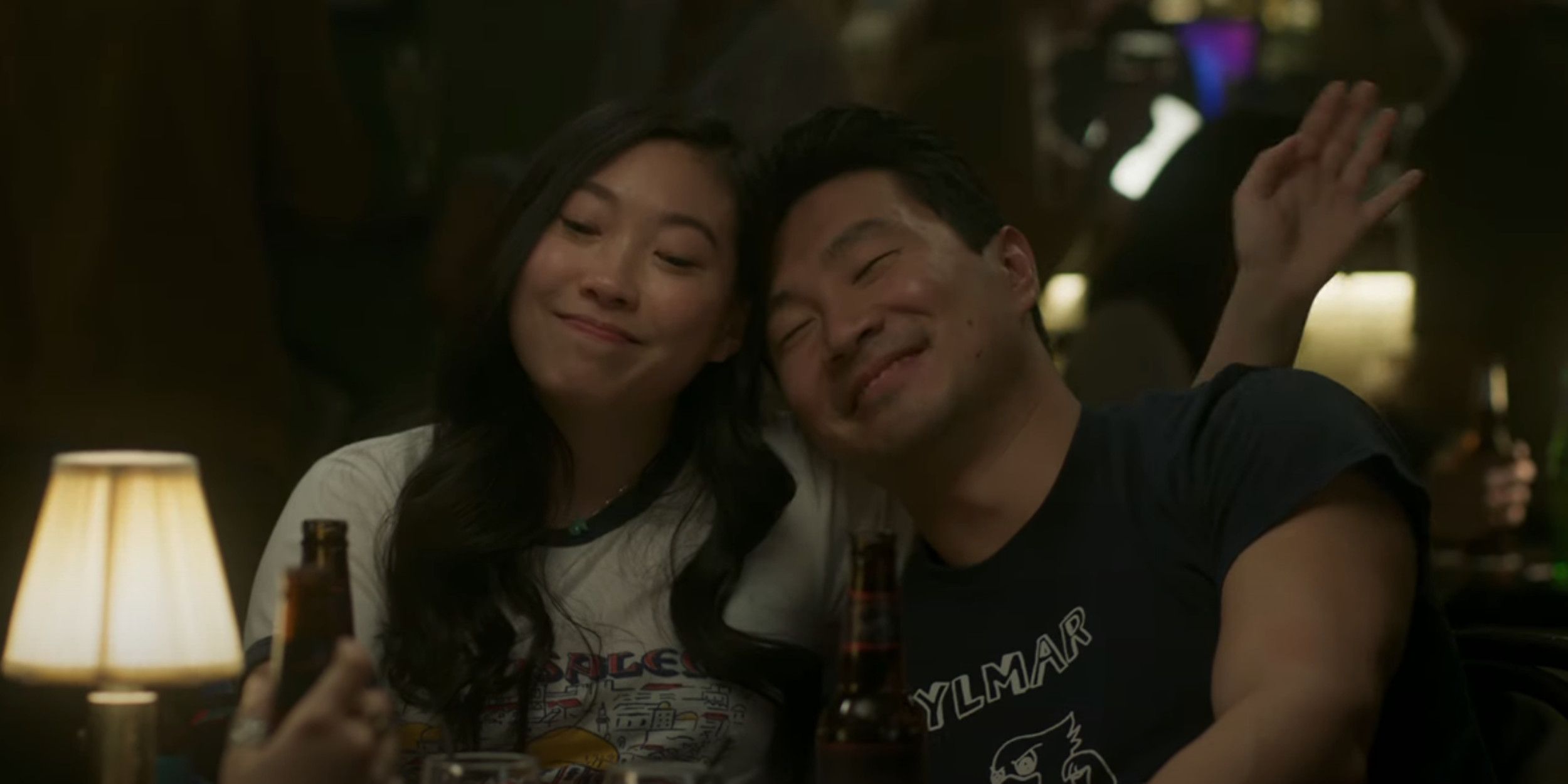 Shang-Chi and Katy sit and drink together