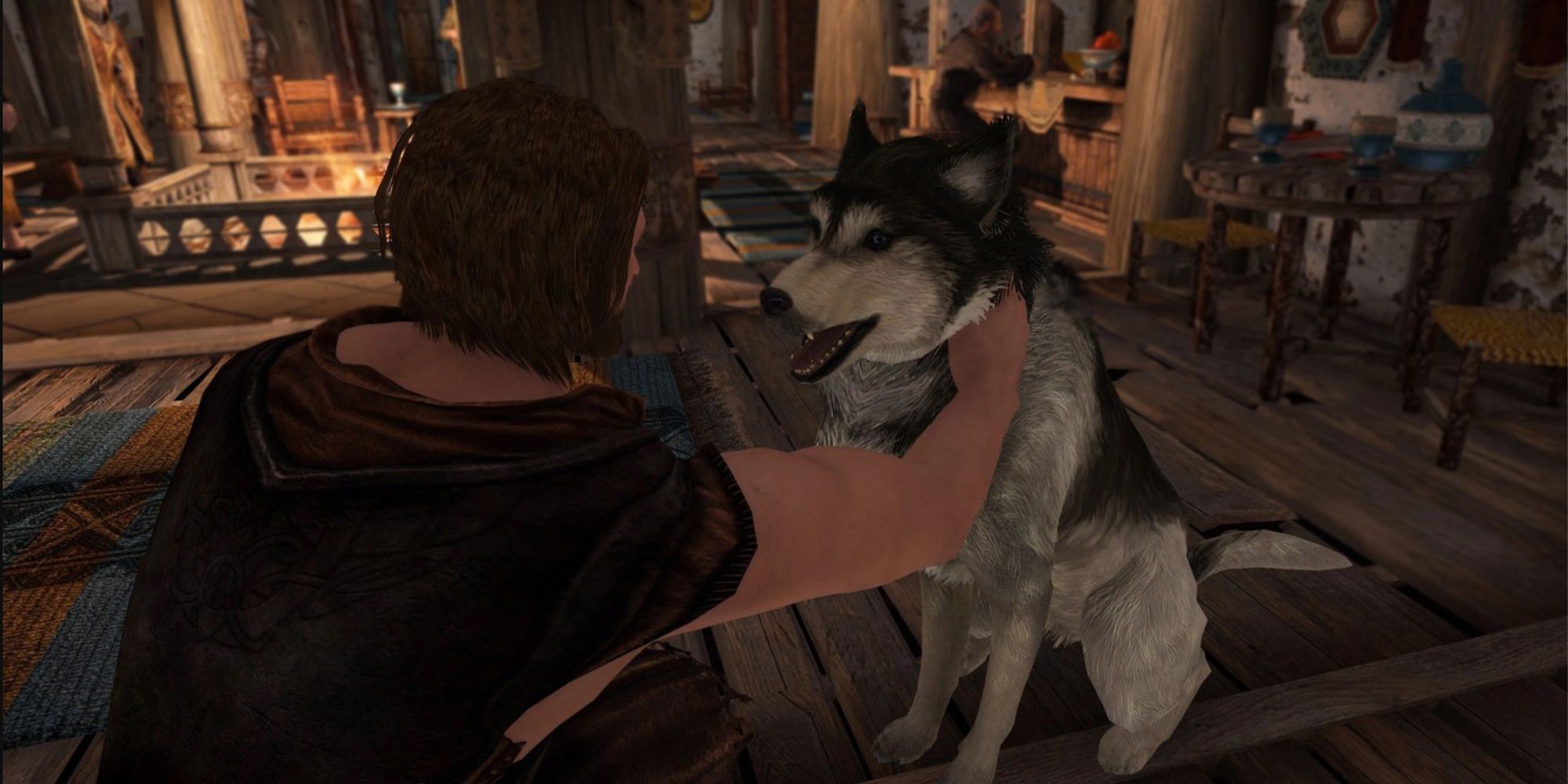 A man pets a dog in Skyrim