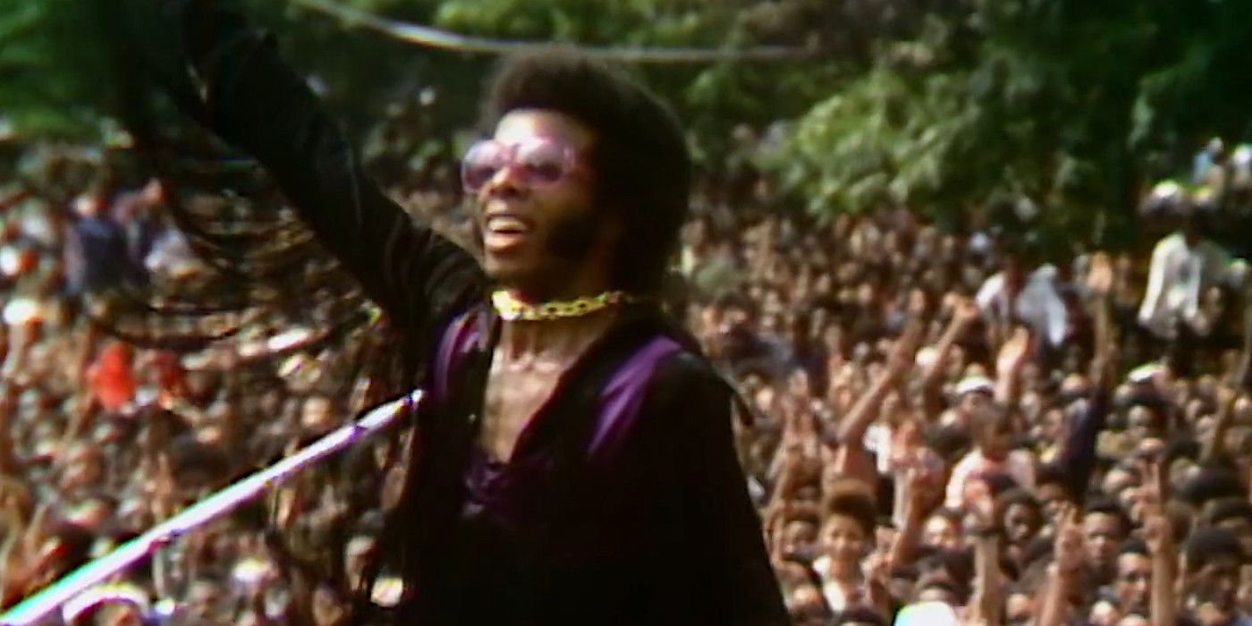 Sly Stone talking to a crowd In Summer Of Soul