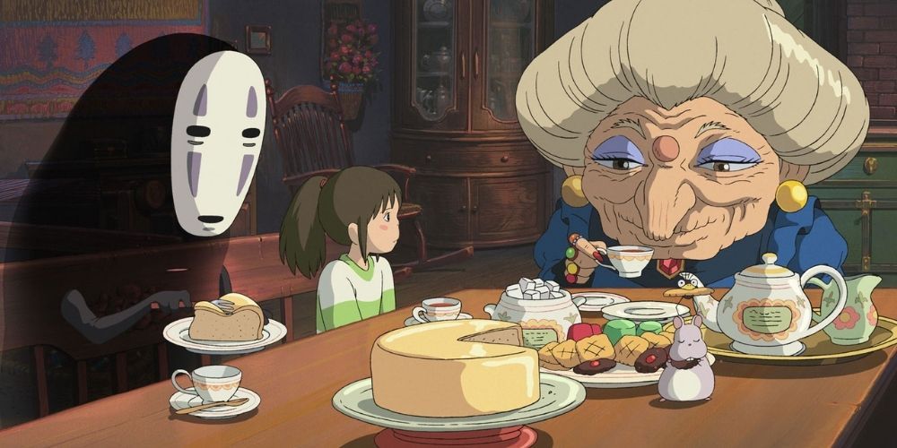 Chihiro and No-Face sit and eat with Zeniba in Spirited Away