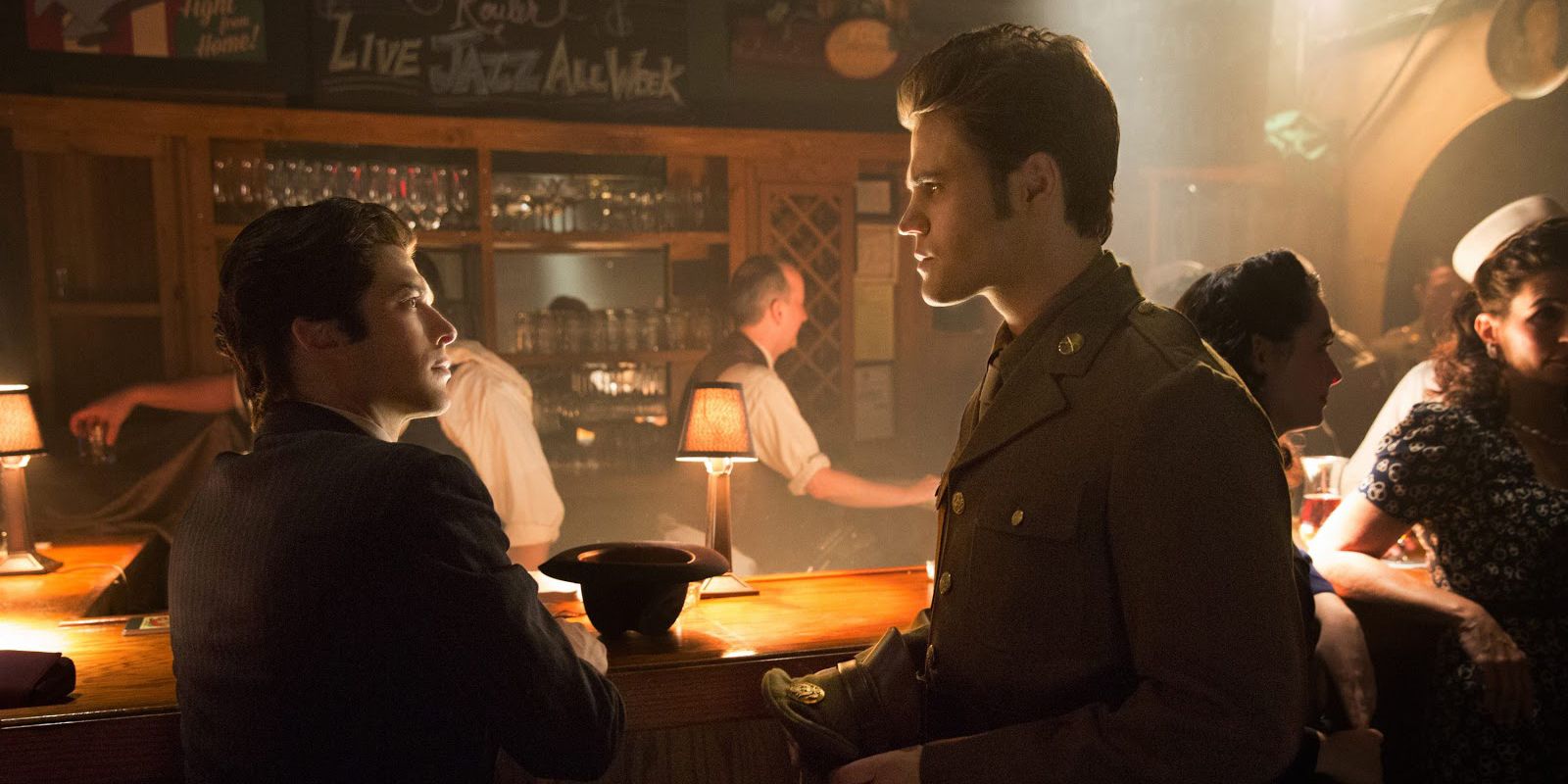 Stefan and Damon at a bar in the 1900s in The Vampire Diaries.