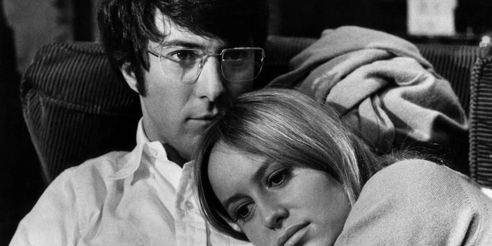 Dustin Hoffman laying with Susan George in Straw Dogs
