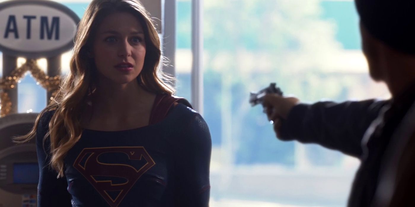 A depowered Supergirl confronts an armed robber