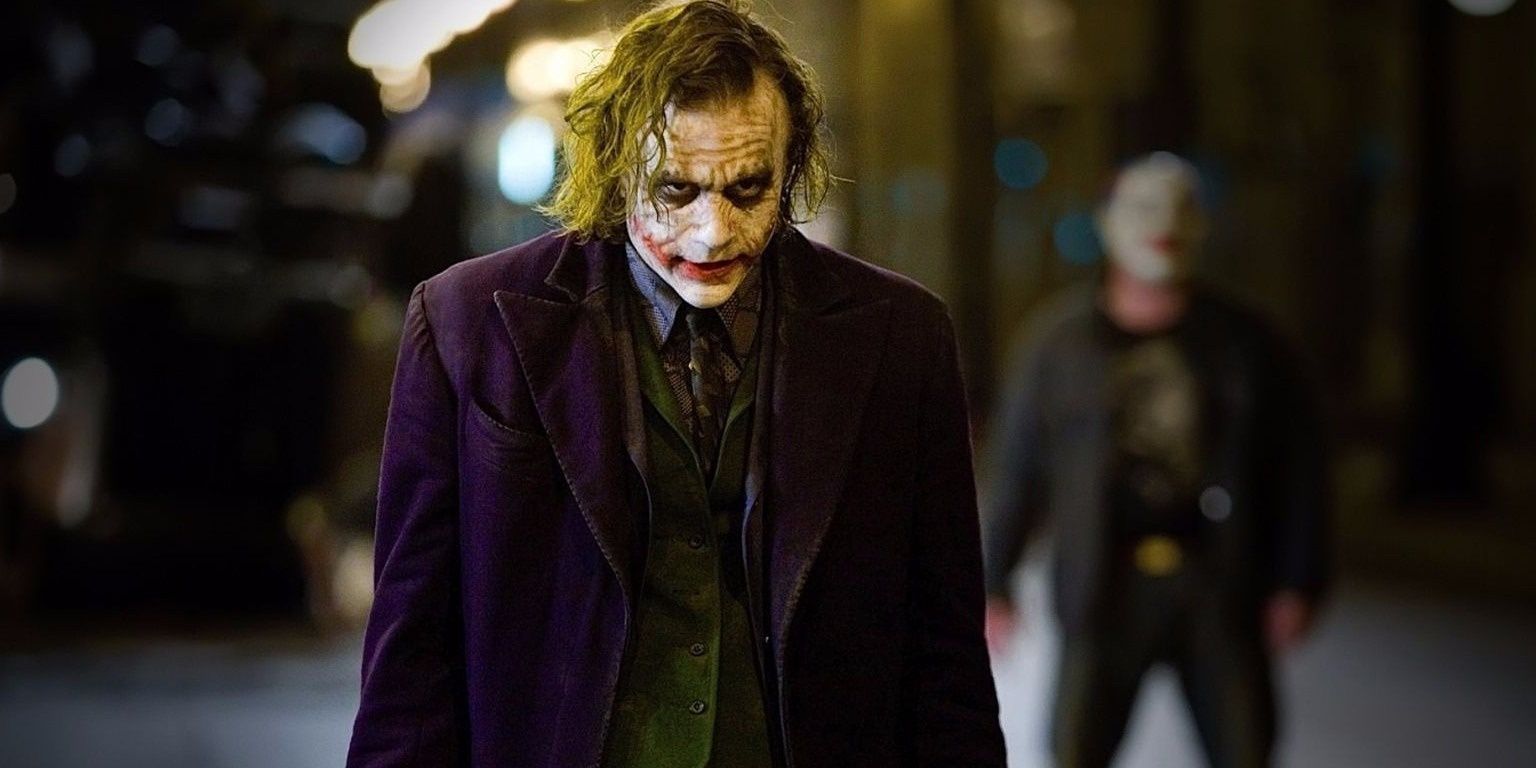 The Joker standing in the middle of the street in The Dark Knight.