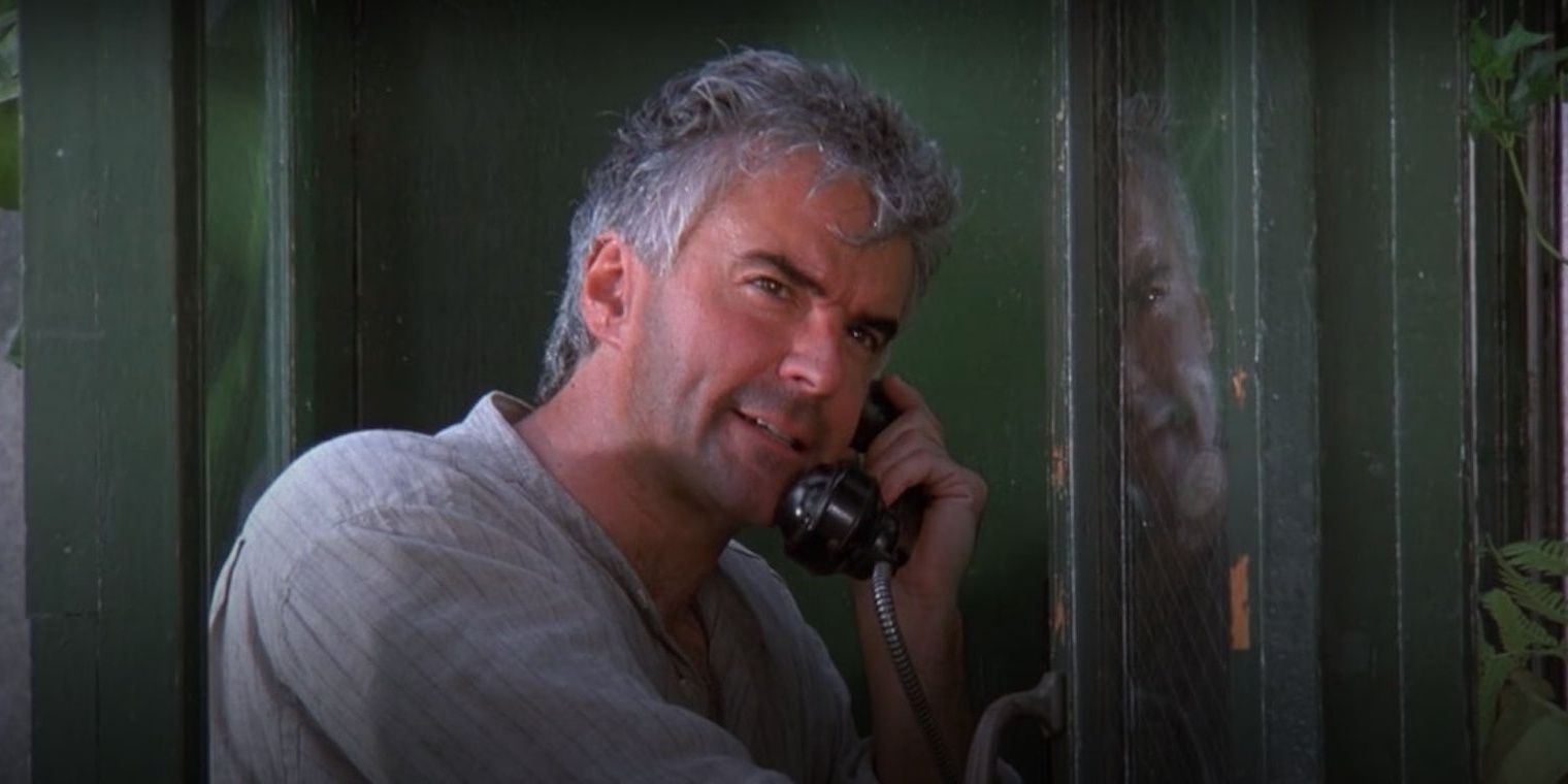 Peterman in telephone booth on phone