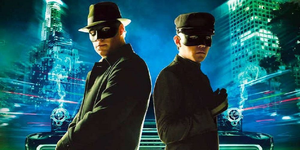 Seth Rogen and Jay Chao in The Green Hornet standing back to back, masked, in front of a blurred cityscape.