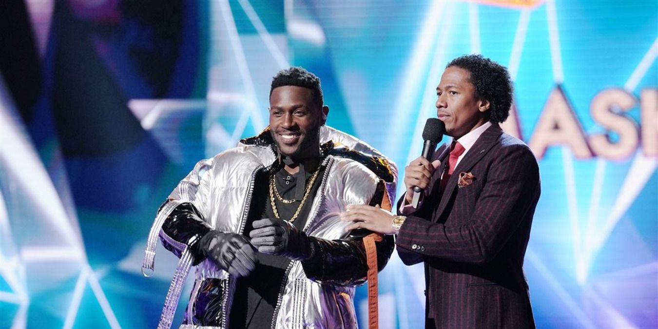 Hippo, Antonio Brown, and Nick Cannon on stage on The Masked Singer