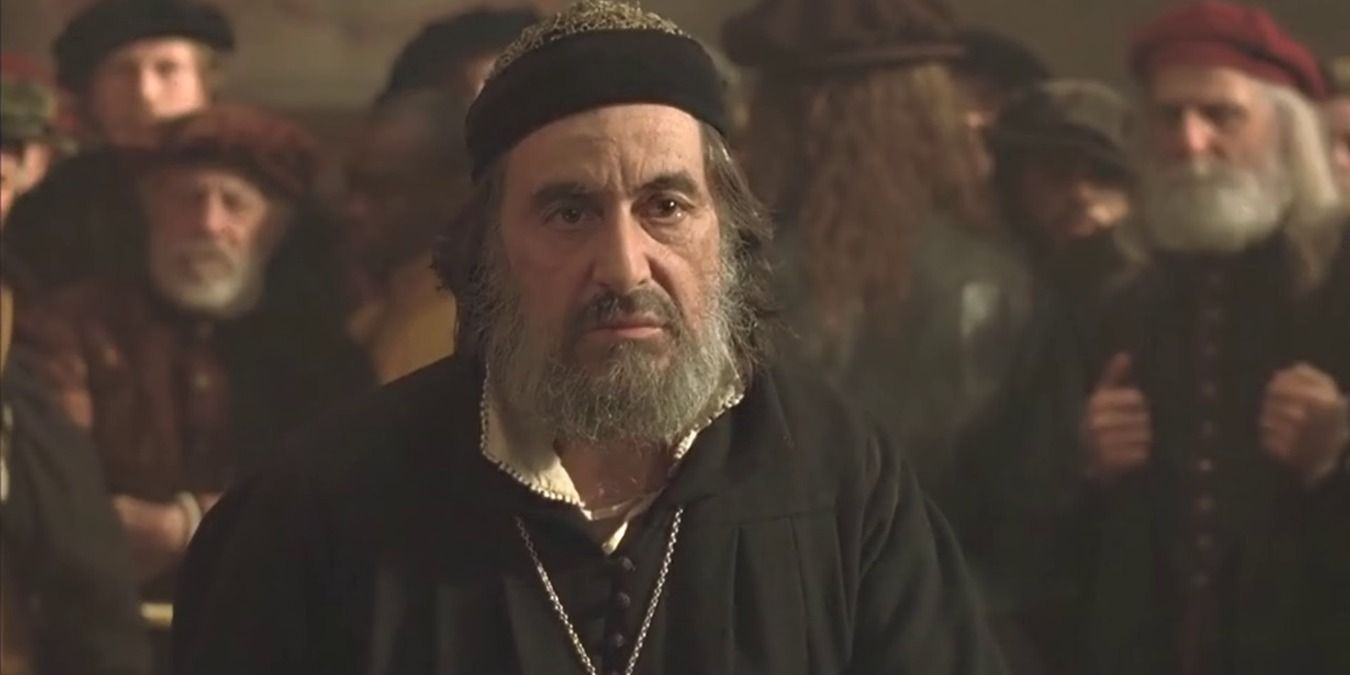 The Merchant of Venice 2007 Al Pacino as Antonio, standing in a group of people looking defeated