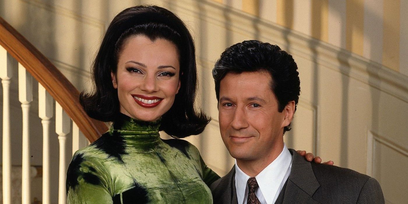 Fran Drescher as Fran Fine and Charles Shaughnessy as Maxwell Scheffield standing on stairs together in The Nanny