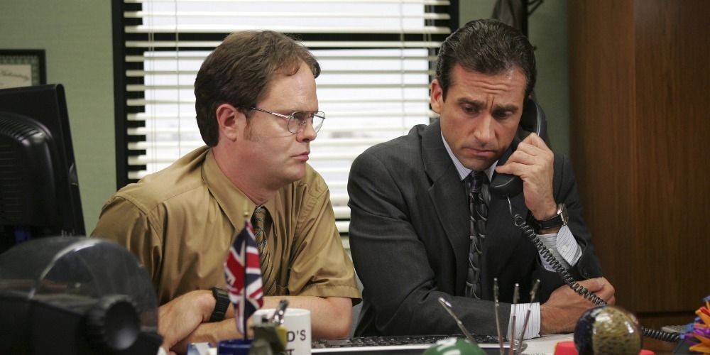 Dwight sitting next to Michael in The Office.