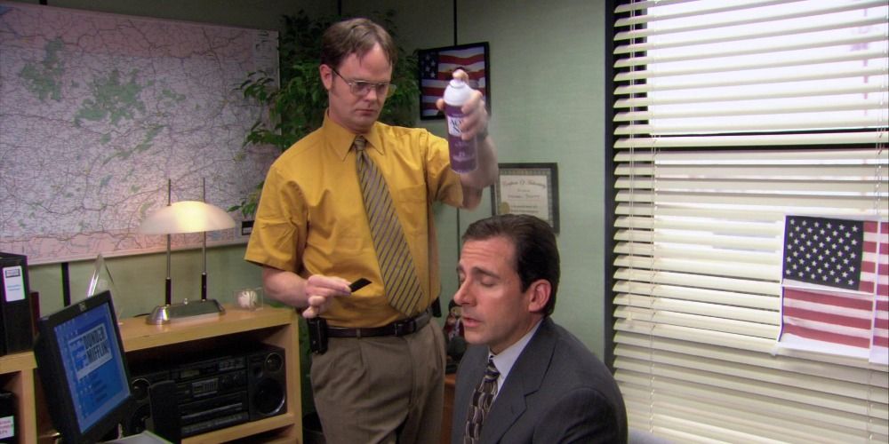 Dwight standing over Michael in The Office.