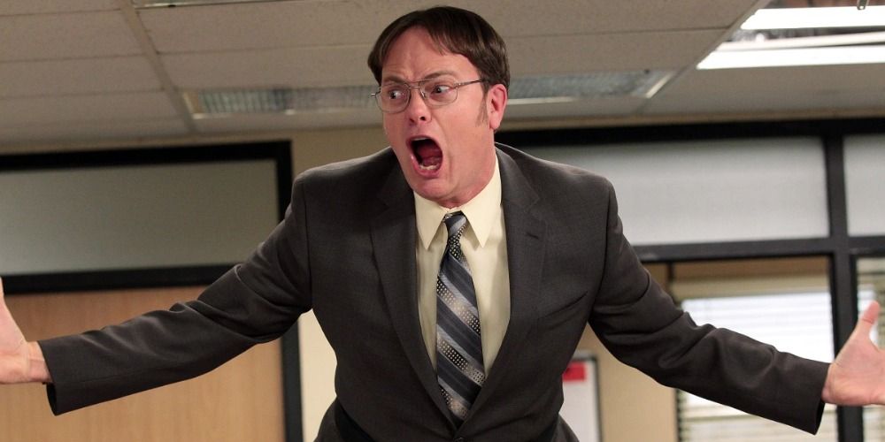 Dwight yelling on top of the desks in The Office