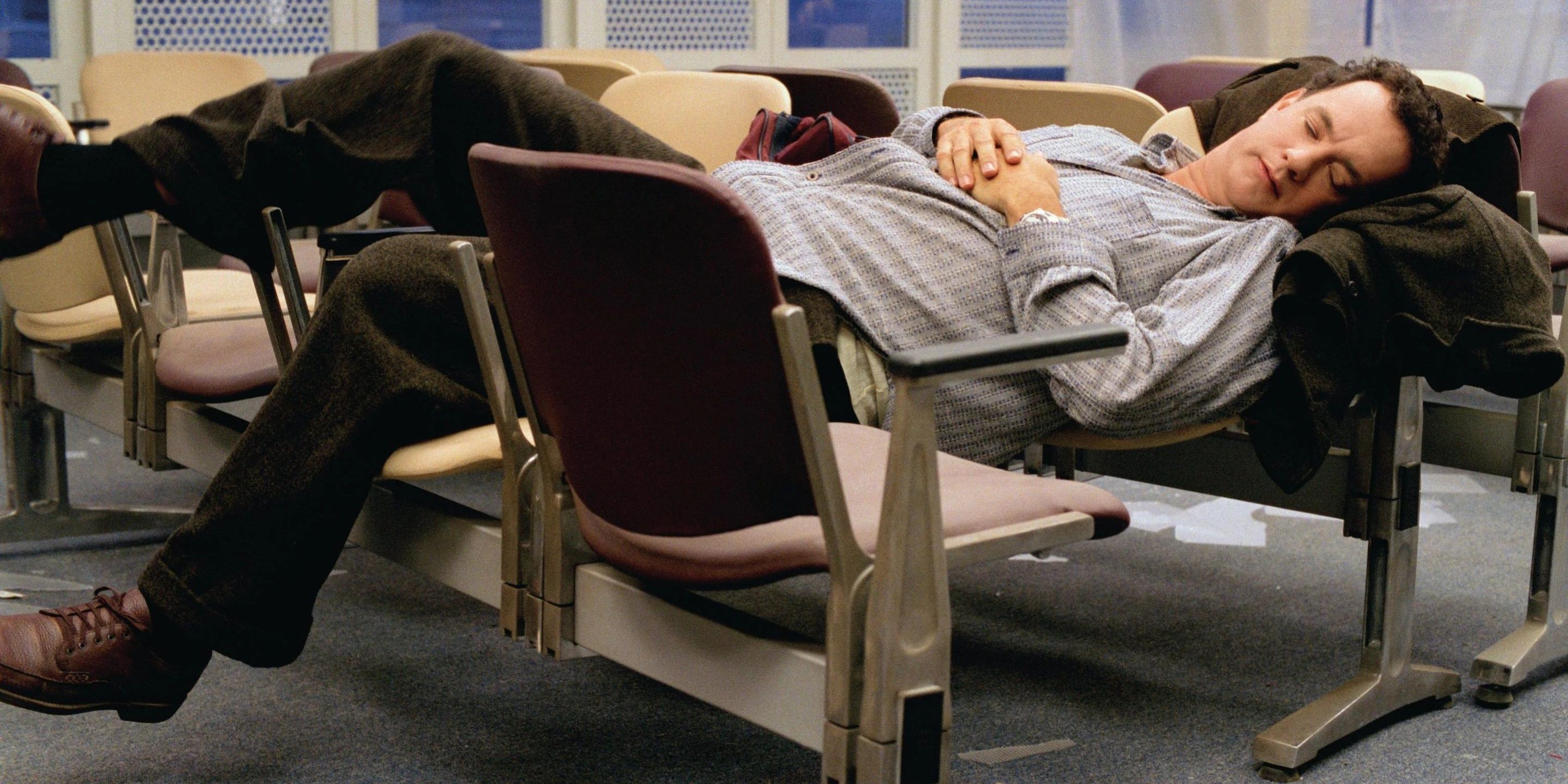 Viktor sleeping in chairs in The Terminal