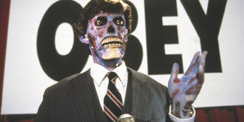 Humanoid standing in front of a sign with his hand out in They Live