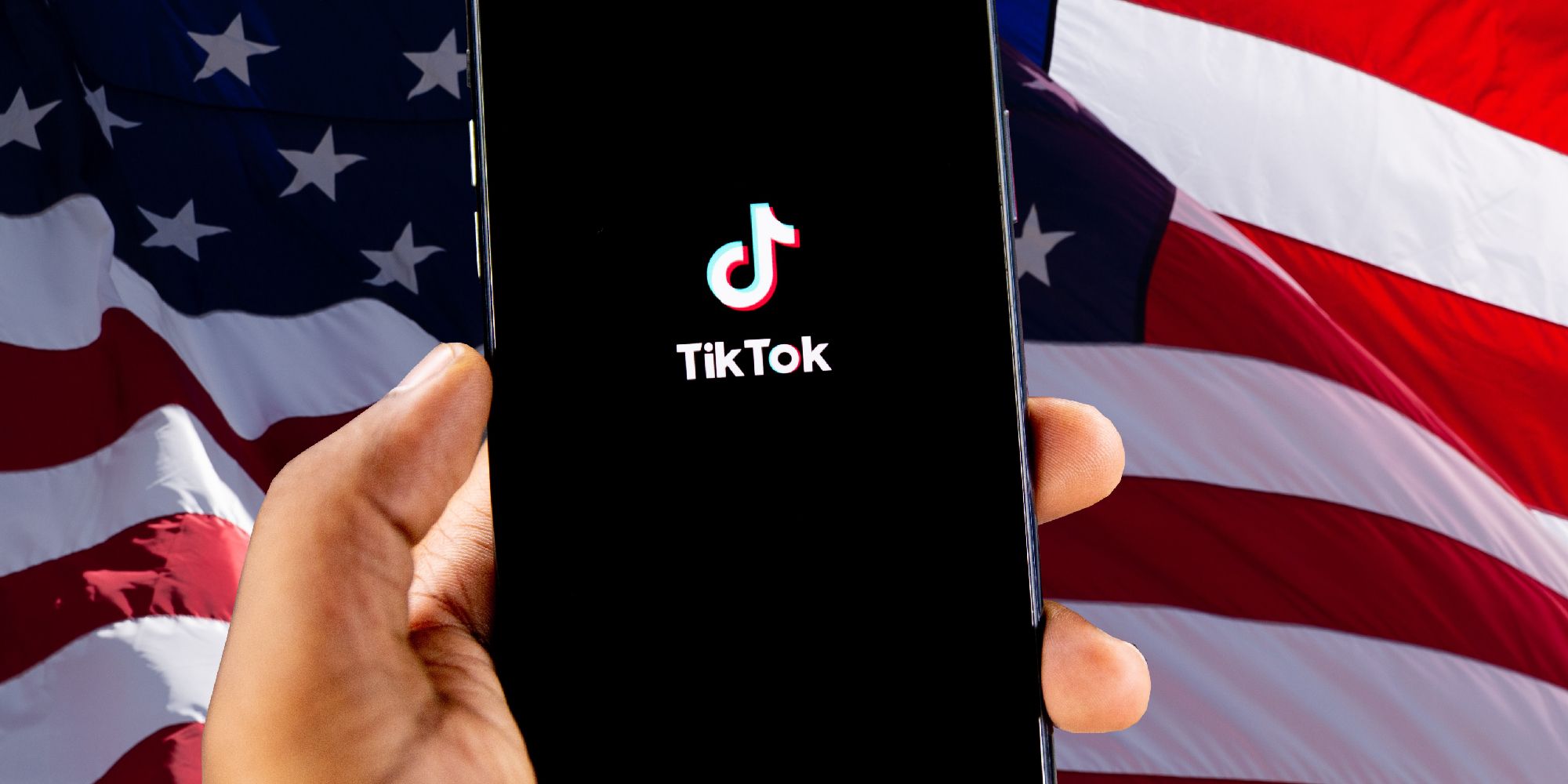 TikTok app on Smartphone in front of US flag
