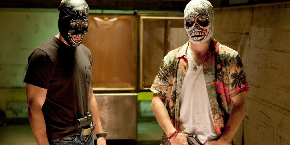 Two men in masks in Savages (2012)
