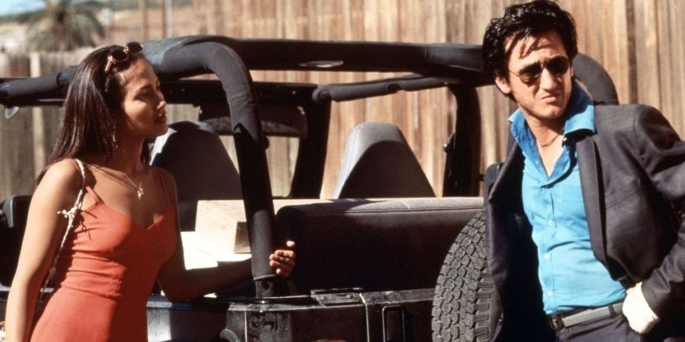 U Turn Jennifer Lopez et Sean Penn dans le rôle de Grace et Bobby, appuyés sur la jeep