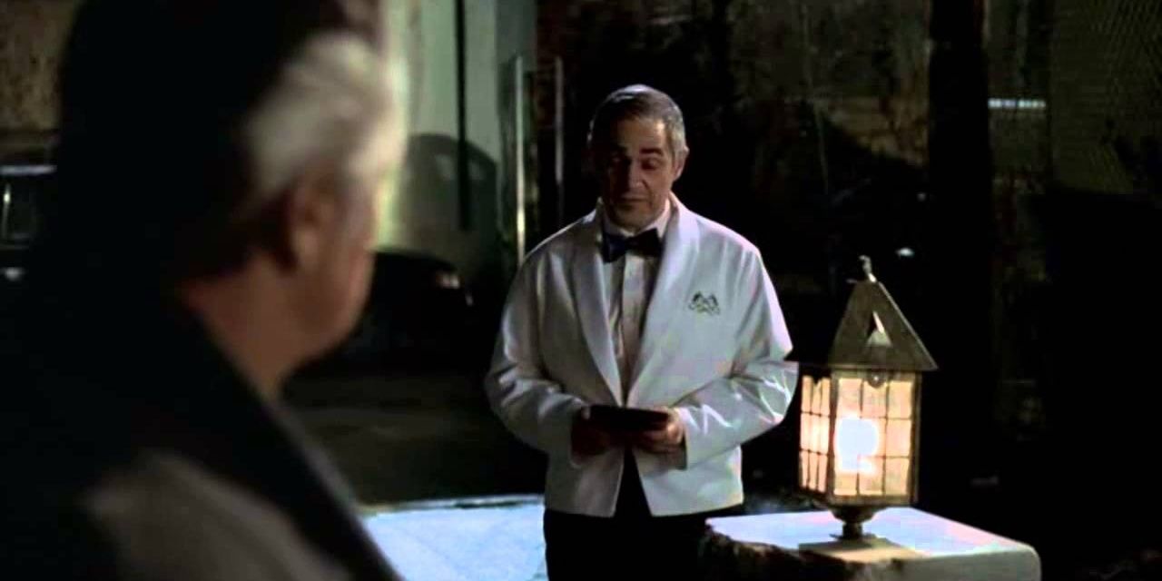 Waiter wearing a white suit