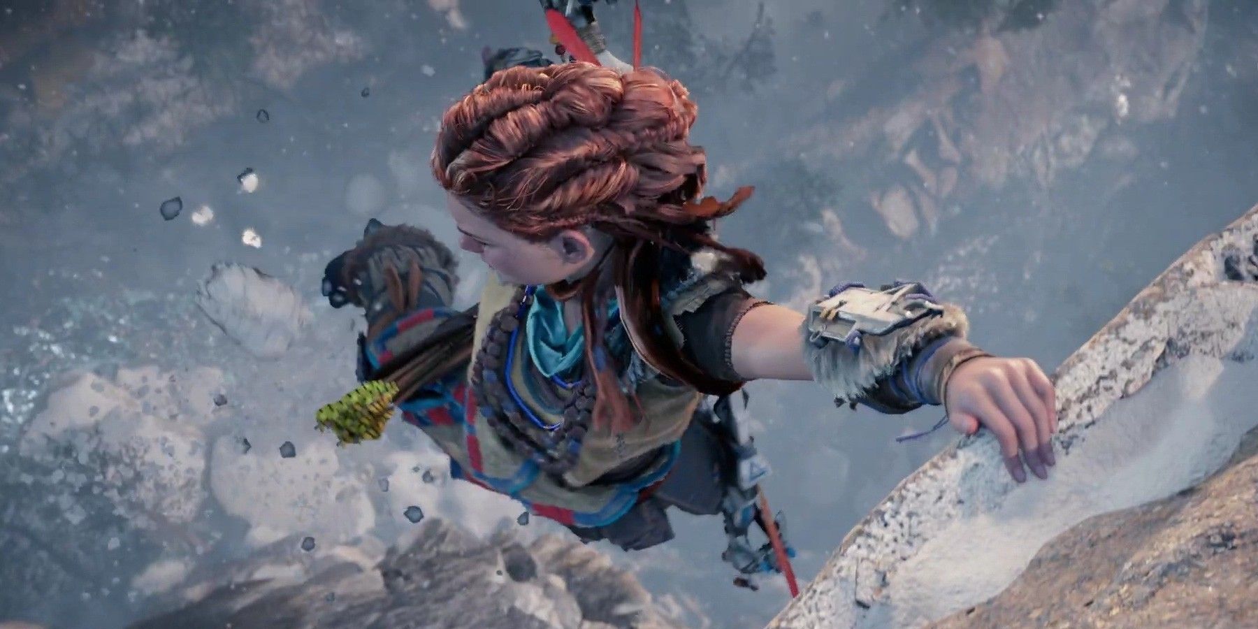 Aloy looks down as she holds onto a rocky surface with one hand in Horizon Forbidden West.