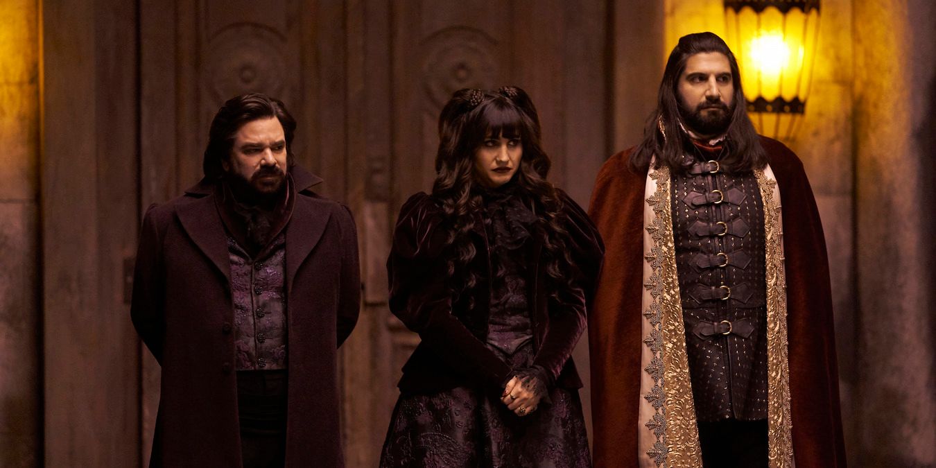 What We Do in the Shadows - the three vampires standing together at their home
