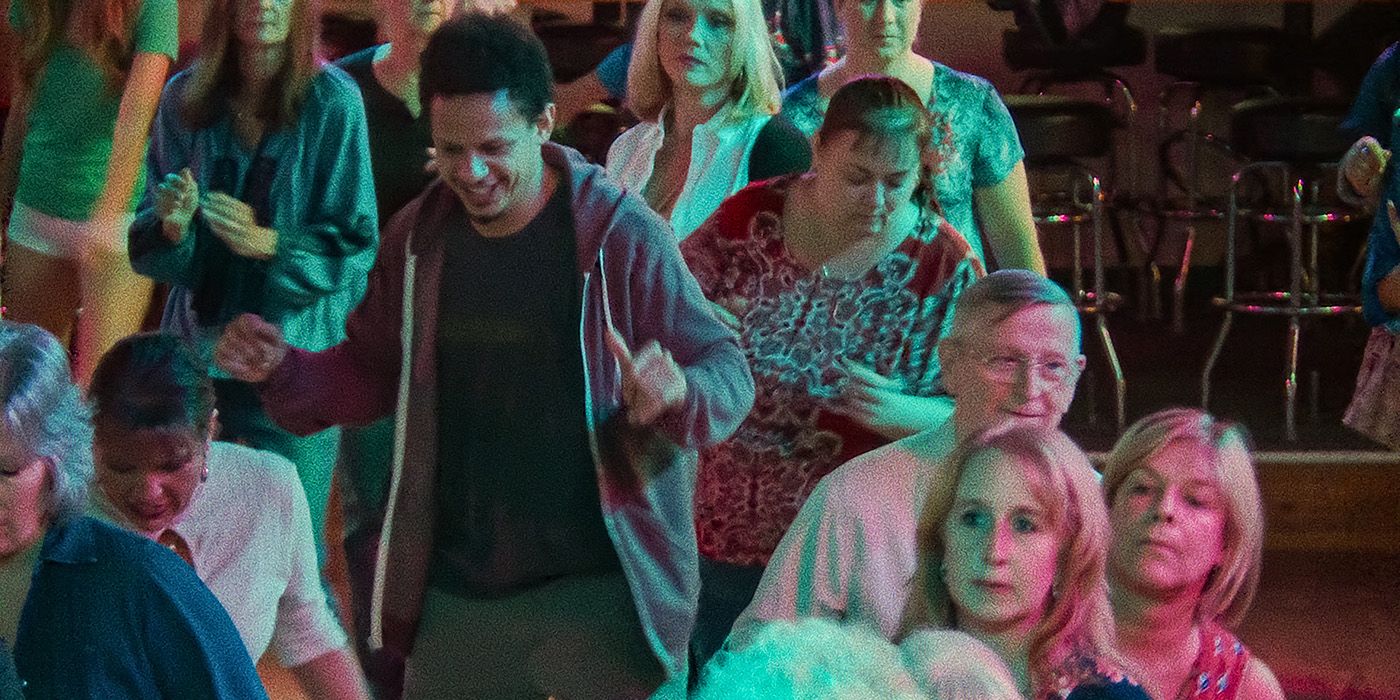 Eric Andre as Chris in Bad Trip pretending to be inebriated in the middle of a country music bar with patrons all around him