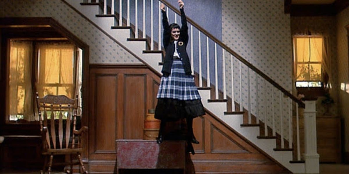 Lydia Deetz floating in the foyer of her home and dancing in Beetlejuice.