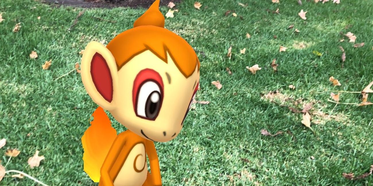 Chimchar sits down outside looking happy in the Pokémon series