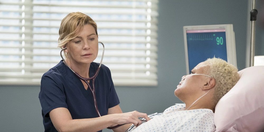 Meredith listens to a patient's heartbeat with a stethoscope in Grey's Anatomy