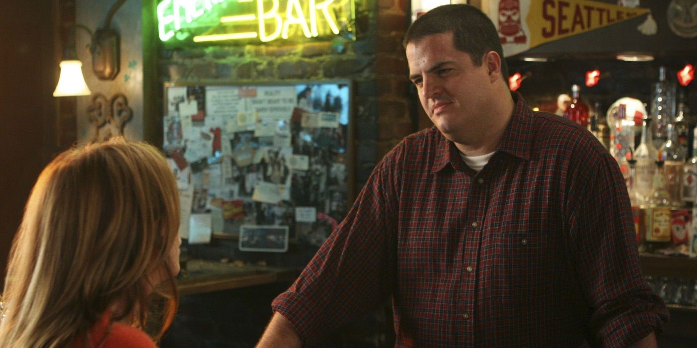 Joe talking to Meredith at the bar.