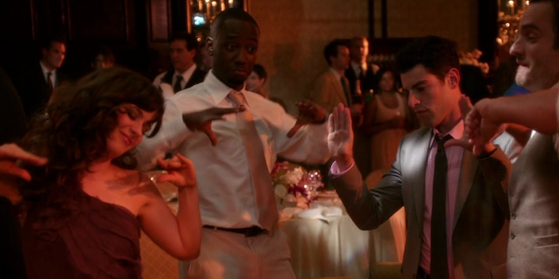 The group doing the chicken dance at the wedding in New Girl.