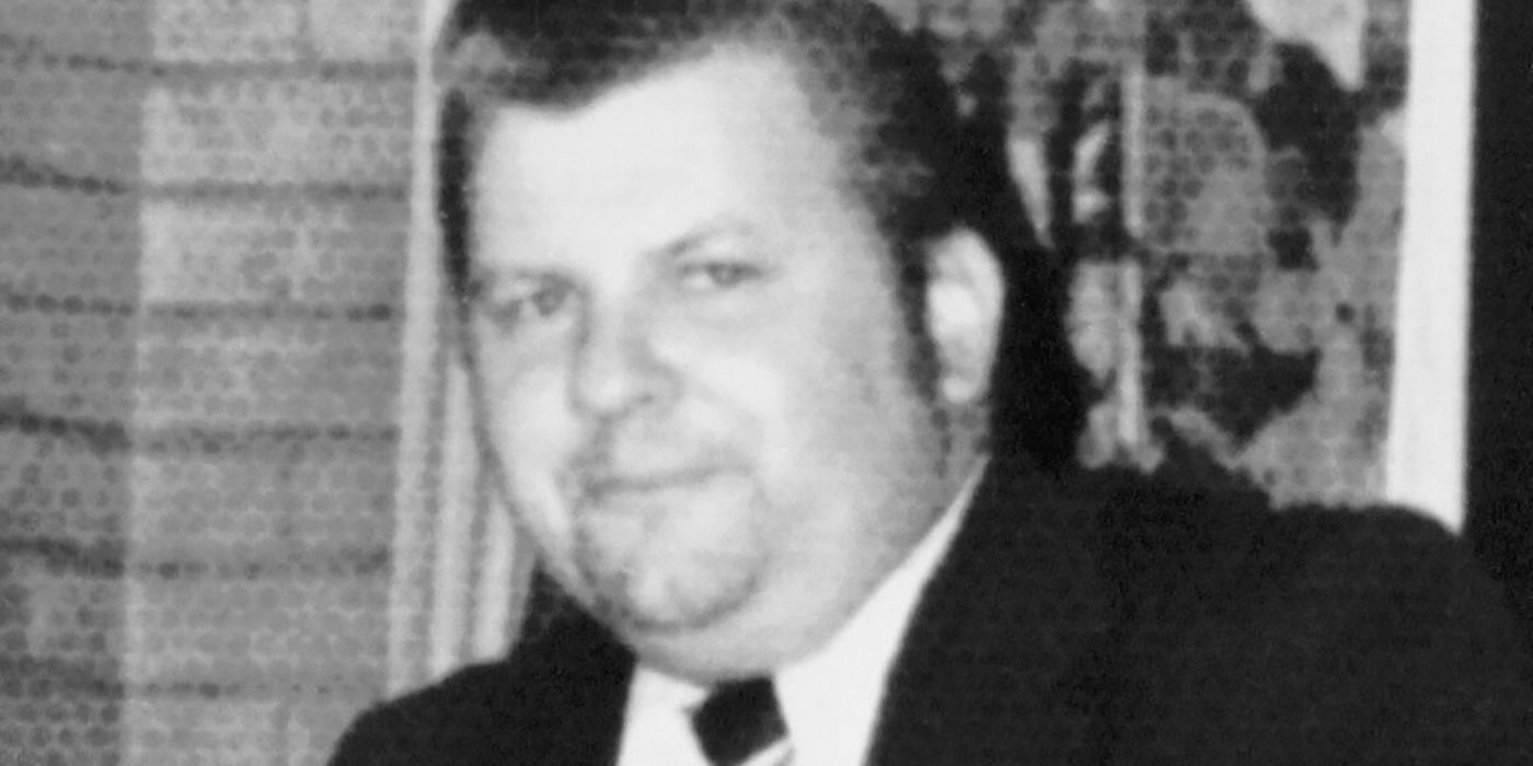 A black-and-white photo of John Wayne Gacy in a suit