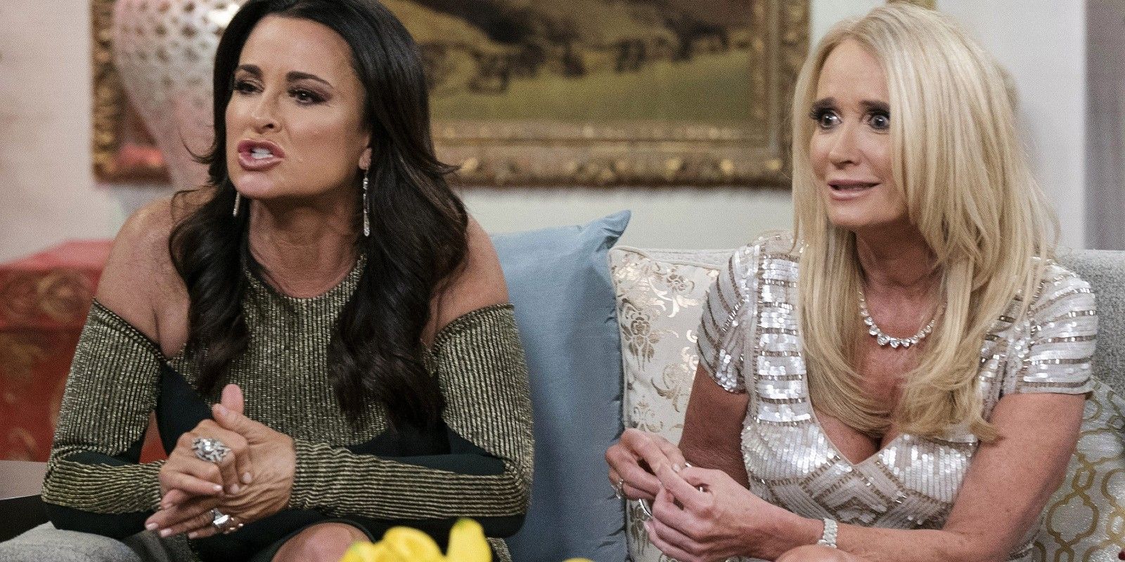 kyle and kim Richards fighting on a couch