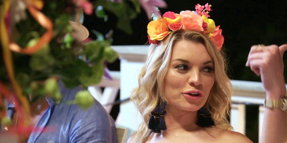 Lindsay wears flower wreath on head in Summer House