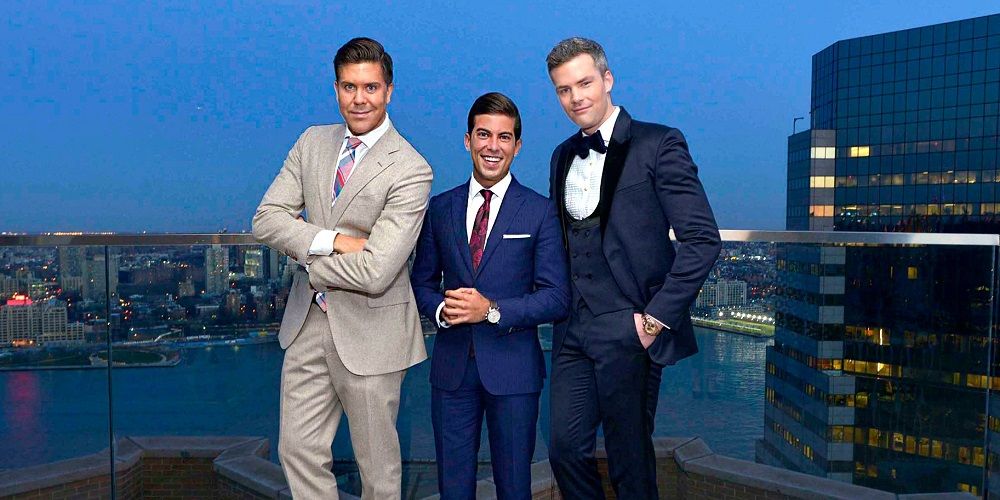 Million Dollar Listing Hosts pose on balcony