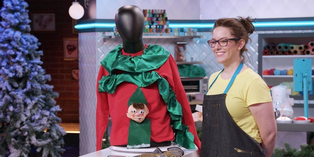 Contestant shows off elf cake in Nailed It Holiday! 1
