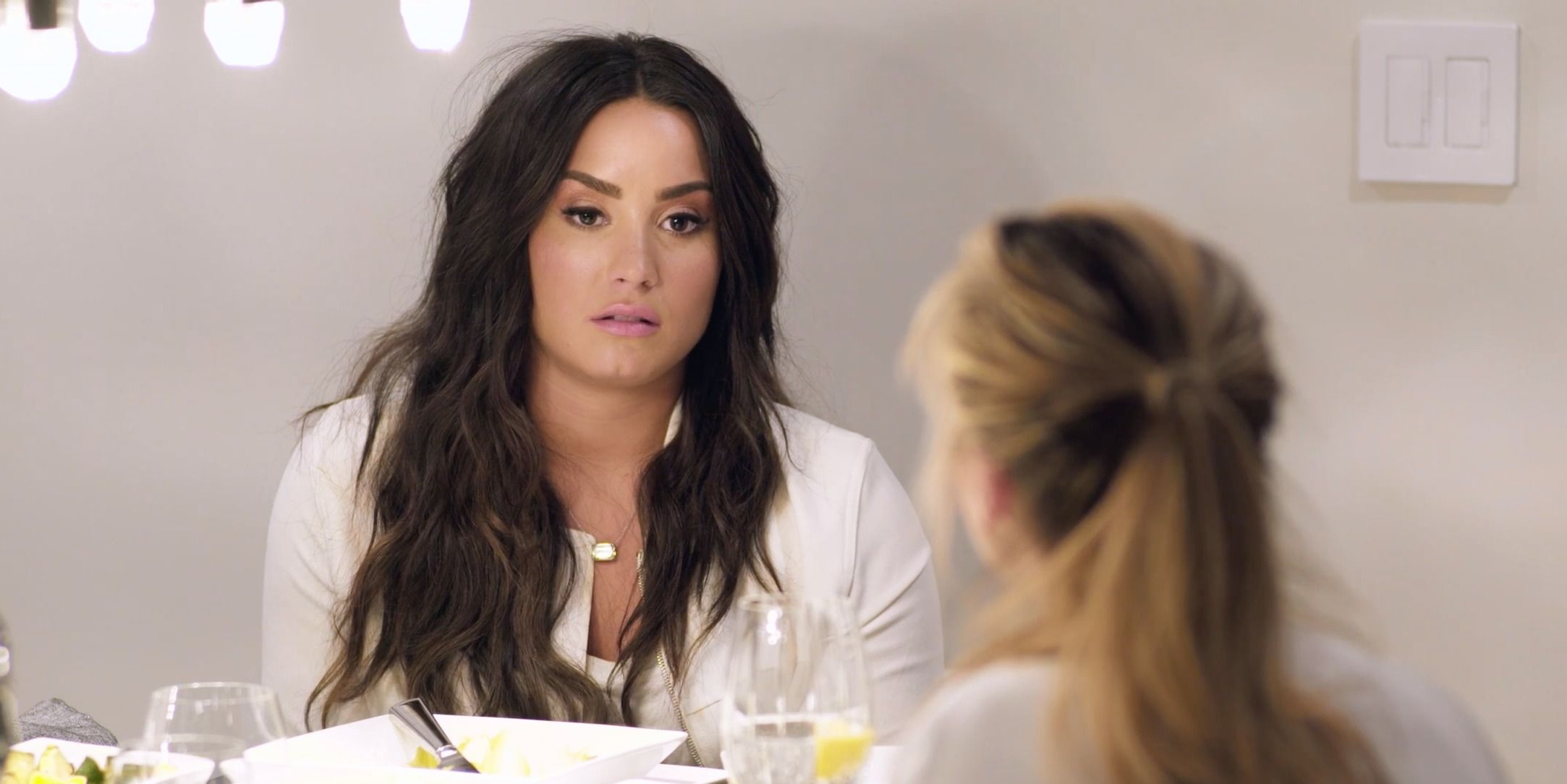 Demi Lovato Talking At Table in Simply Complicated