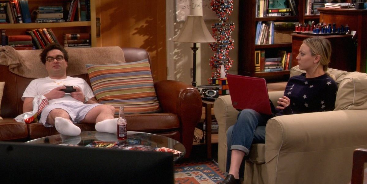 Penny sits near a disheveled Leonard, sitting in his underwear, in The Big Bang Theory