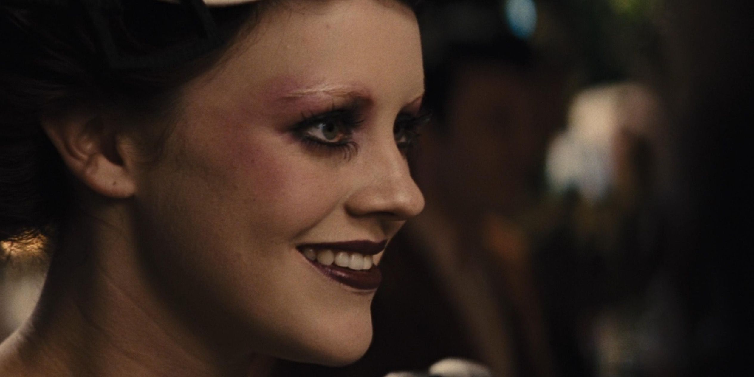 Octavia from The Hunger Games talking wearing dark lipstick