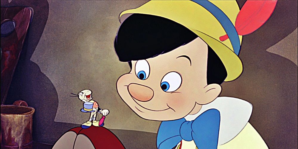 Jiminy sits on Pinocchio's shoe in Pinocchio