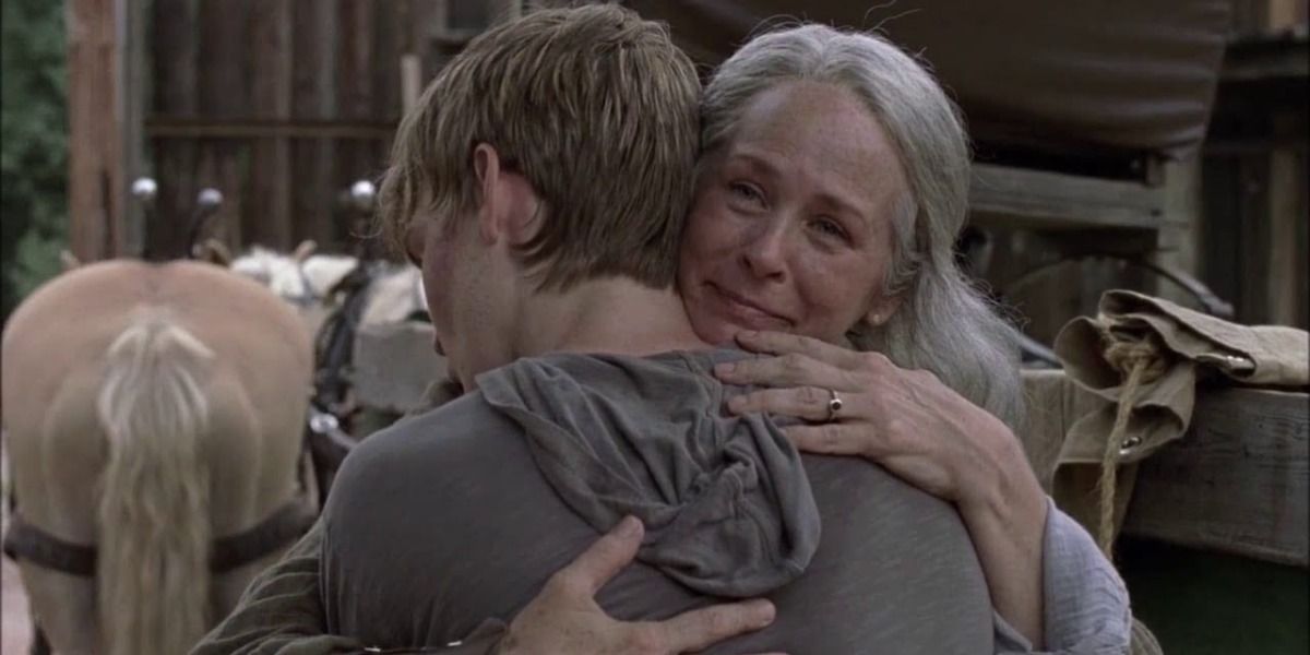 carol hugs her son henry in amc's the walking dead