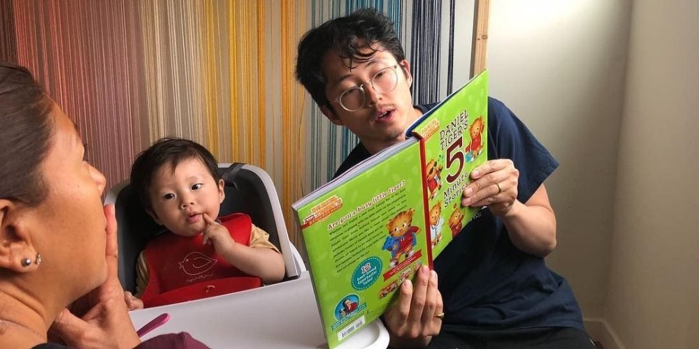 steven yeun reading to his son from joana pak's instagram