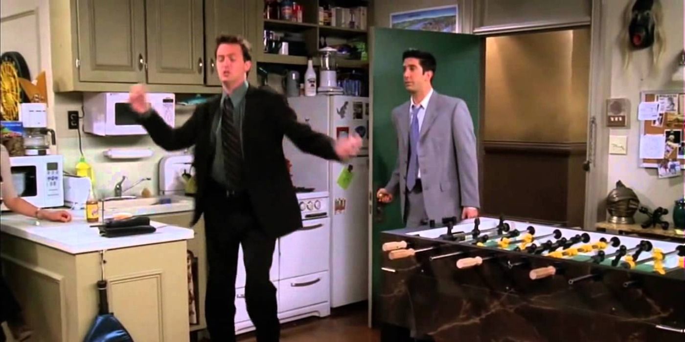 Chandler dancing with Ross in the background in Friends