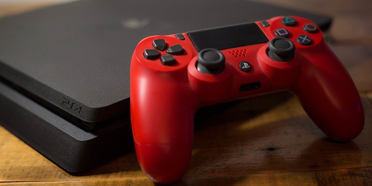 A black PS$ with a red PS$ controller
