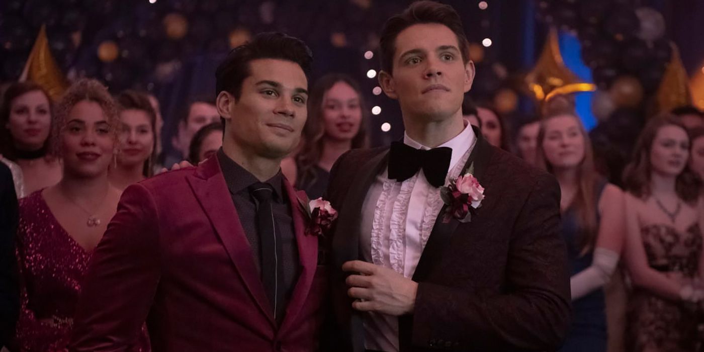 Kevin and Fangs from Riverdale all dressed up looking on stage at prom