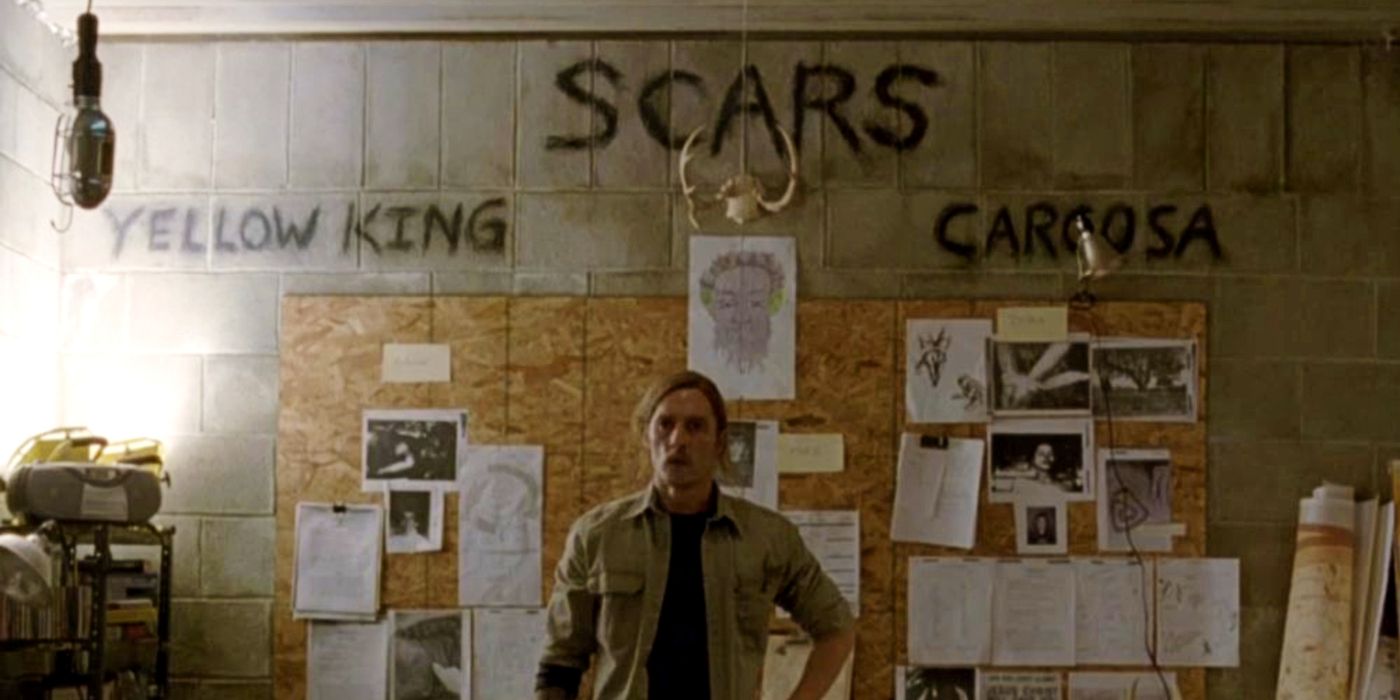 Matthew McConaughey as Rust Cohle in front of his makeshift murder board in his storage unit in True Detective